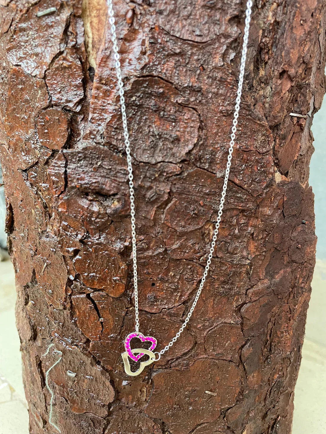 Pink double heart pendant with silver plated chain